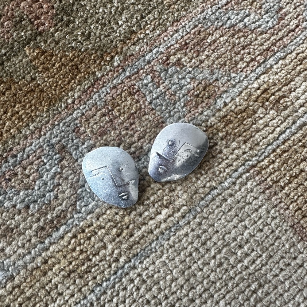 Mango face metal earrings